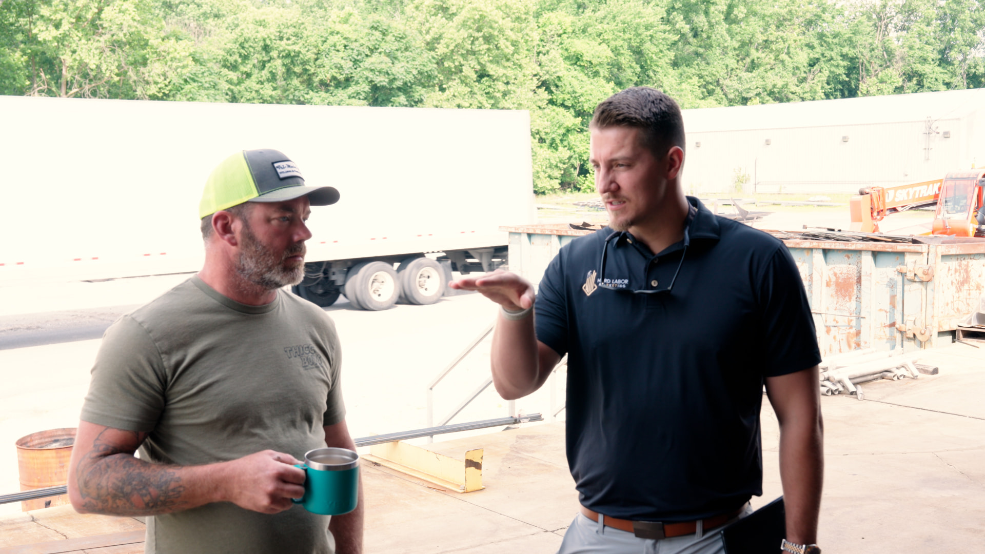 A Hard Labor Marketing team member talking one on one with a contractor at his shop