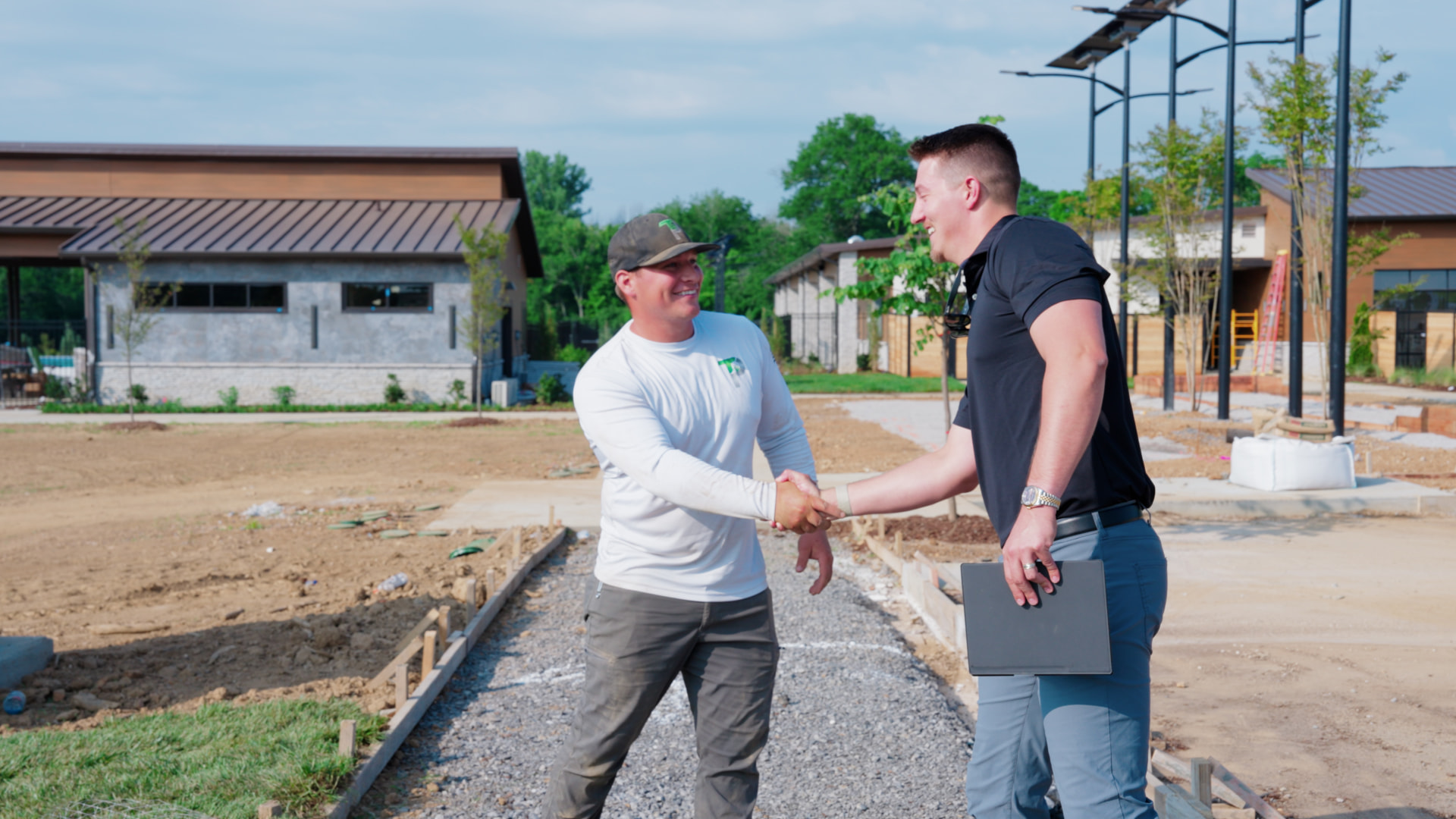 A Hard Labor Marketing team member shaking hands with a contractor on a jobsite